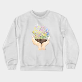 wildflowers on hand Crewneck Sweatshirt